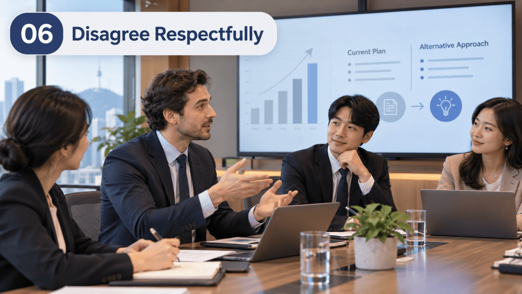 A business meeting scene featuring four professionals discussing a plan. One person is passionately explaining, while the others listen attentively. A presentation screen in the background displays graphs and text labeled 'Current Plan' and 'Alternative Approach'.