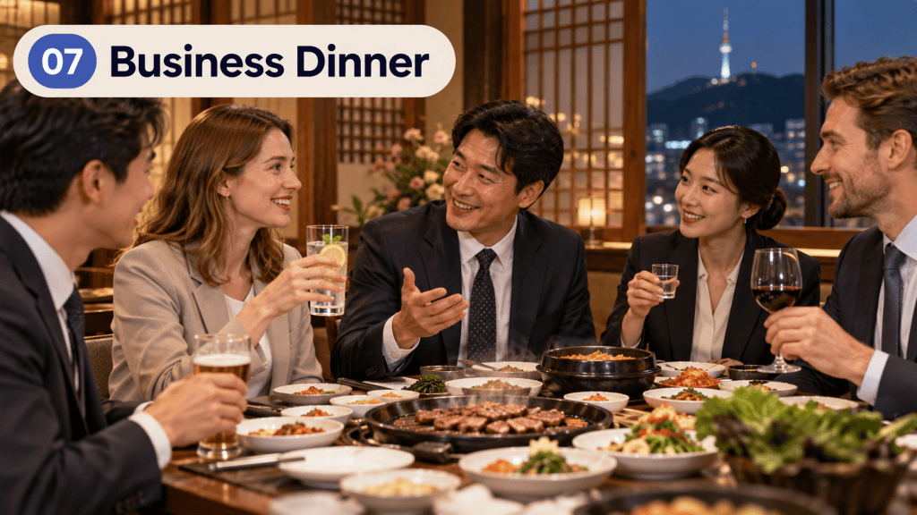 A group of five professionals enjoying a business dinner in an elegant setting, with various dishes served on the table and a city view in the background.